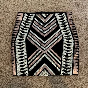 Form fitting black with gold sequin mini skirt from Express